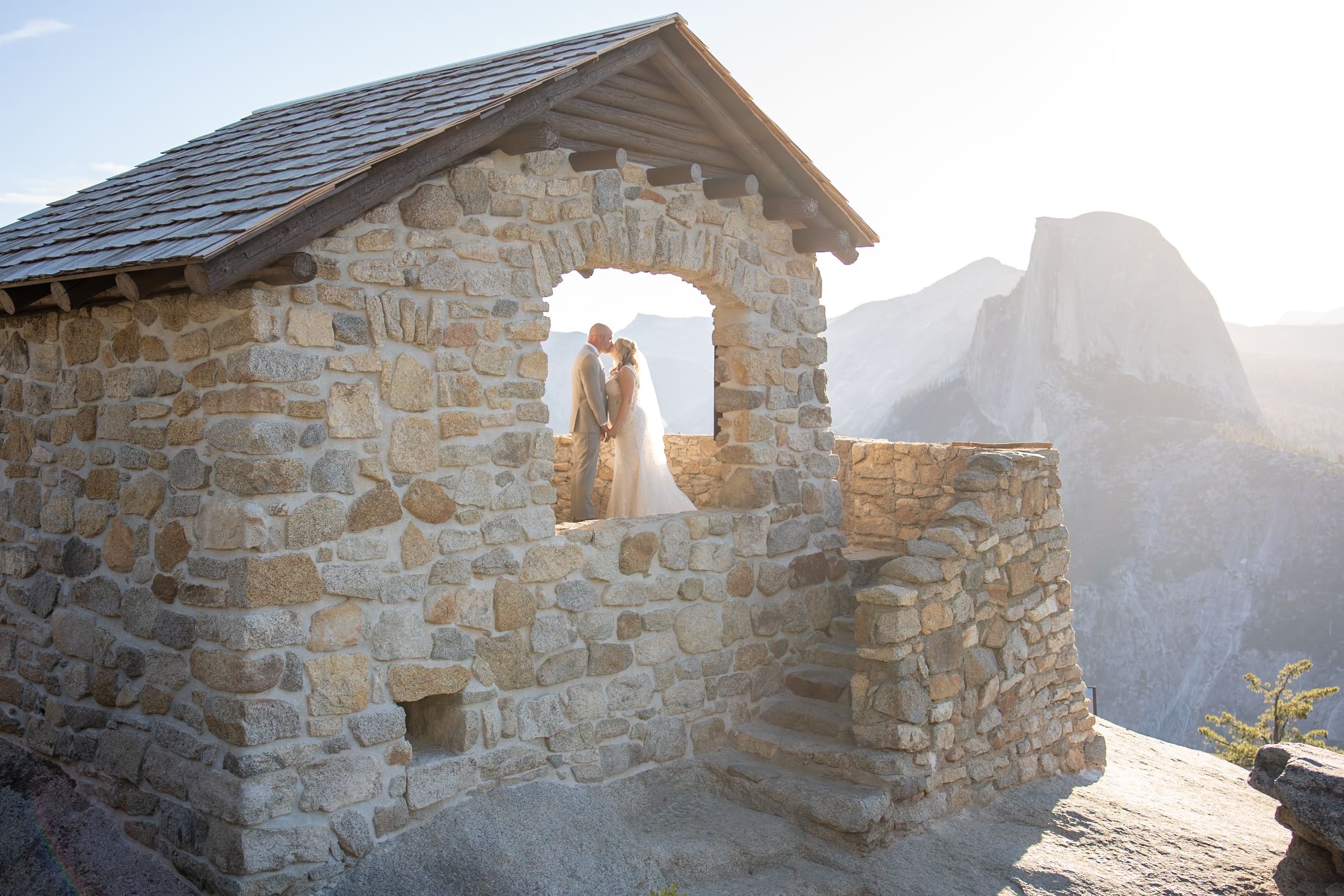 Couple at Glacier Point, Yosemite with views of Half Dome.